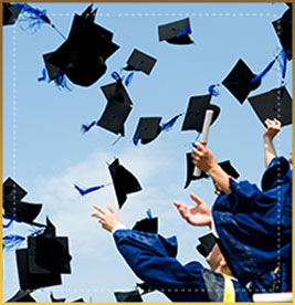 Students throw graduation caps in the air