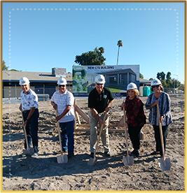 Corcoran USD admin team with shovels at construction site