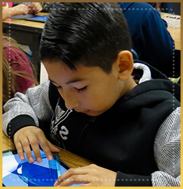 Student plays a puzzle game on a tablet