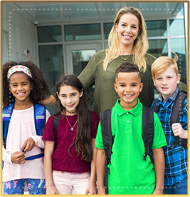 Students standing with their teacher