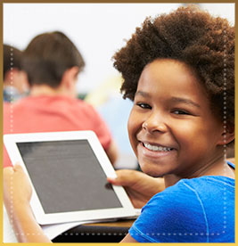 Smiling student holds computer tablet