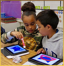 Students hold markers and look at tablets