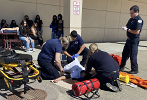 EMT teachers working with students outside